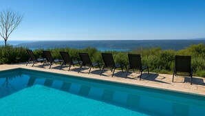 A pool with lounge chairs and a view of the landscape. - 3 bedroom stunning home in Gora Glusic (Gora Glusic)