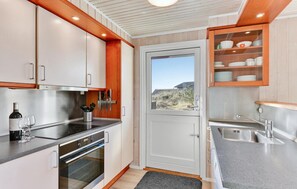Fridge, stovetop, dishwasher, coffee/tea maker