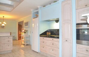 Fridge, stovetop, dishwasher, coffee/tea maker
