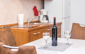 Fridge, stovetop, dishwasher, coffee/tea maker