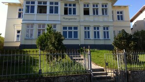 A two-story building named 'Margarete' with a symmetrical facade, large windows, and a central entrance. - Villa Margarete Whg. 6 - Villa Margarete, BEACH NEXT (Heringsdorf)