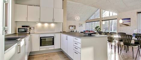 Fridge, stovetop, dishwasher, coffee/tea maker