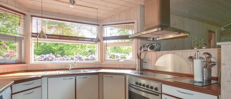 Fridge, stovetop, dishwasher, coffee/tea maker