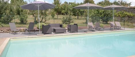 Outdoor pool, a heated pool, sun loungers