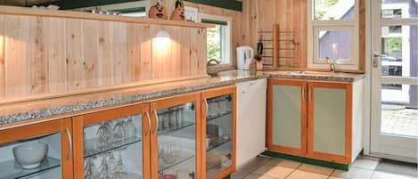 Fridge, stovetop, dishwasher, coffee/tea maker