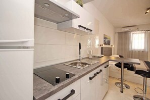 Fridge, microwave, stovetop, coffee/tea maker