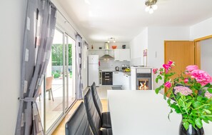 Fridge, stovetop, dishwasher, coffee/tea maker