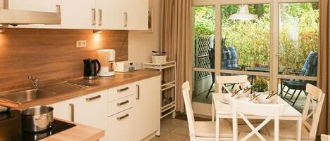 Een koelkast, een oven, een vaatwasser