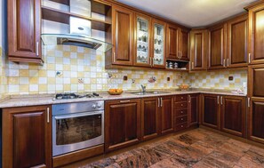 Fridge, stovetop, dishwasher, coffee/tea maker