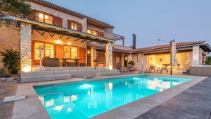 A two-story house with a swimming pool, outdoor seating, and a barbecue area. - Pet friendly home in Jadrija with sauna (Jadrija)