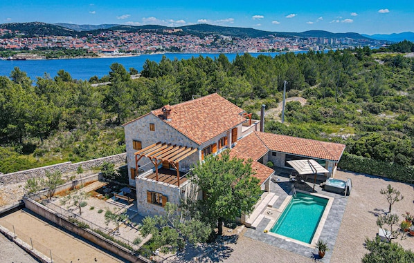 Enjoy panoramic views of the coastal town and sea from this two-story property.