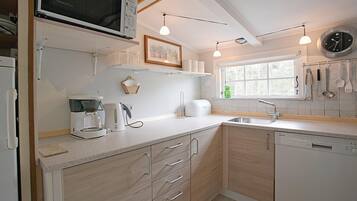 Fridge, stovetop, dishwasher, coffee/tea maker