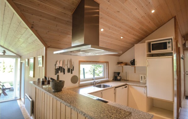 Fridge, stovetop, dishwasher, coffee/tea maker