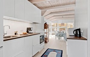 Fridge, stovetop, dishwasher, coffee/tea maker