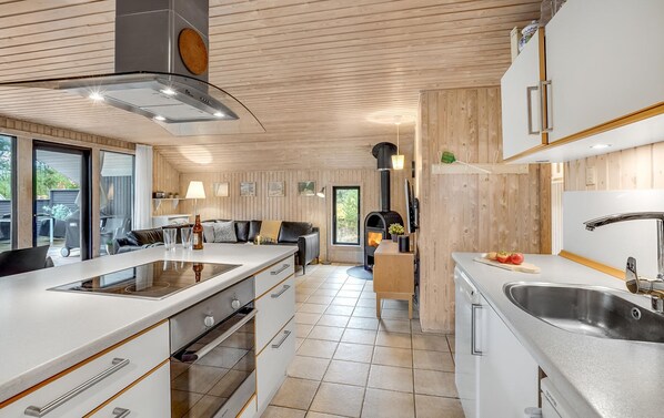 Fridge, stovetop, dishwasher, coffee/tea maker