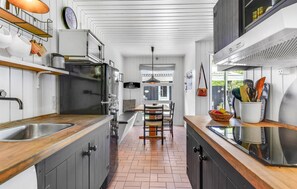 Fridge, stovetop, dishwasher, coffee/tea maker