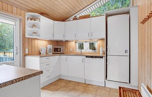 Fridge, stovetop, dishwasher, coffee/tea maker