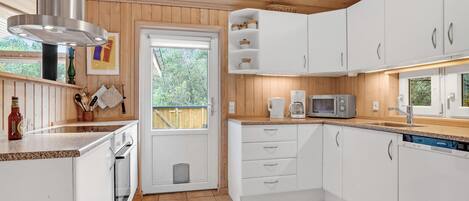 Fridge, stovetop, dishwasher, coffee/tea maker