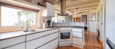 Fridge, stovetop, dishwasher, coffee/tea maker