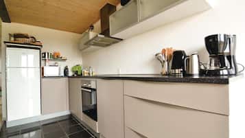 Fridge, stovetop, dishwasher, coffee/tea maker