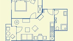 Een plattegrond met een keuken, een eetgedeelte en een woonkamer met een bank en een televisie.