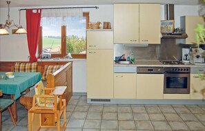 Fridge, stovetop, dishwasher, coffee/tea maker