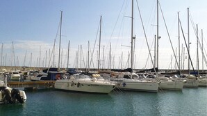 A marina with multiple sailboats docked. - Lovely apartment in Rosignano LI (Rosignano LI)