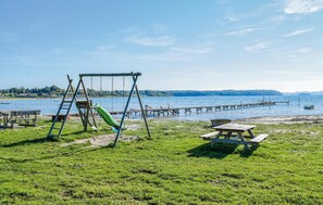 Enjoy a serene lakeside setting with a playground, picnic area, and scenic pier.