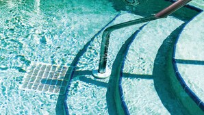 A pool with clear water, a metal ladder, and a tiled deck. - Gorgeous home in Barbarano Vicentino VI (Barbarano Vicentino VI)