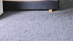 A bedroom with a sloped ceiling, a bed, a window, and a carpeted floor. - 1 bedroom nice home in Figeholm (Figeholm)