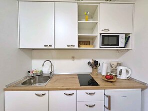 Microwave, stovetop, coffee/tea maker, toaster