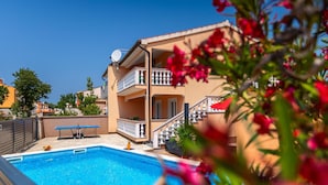 A two-story building with a swimming pool, a balcony, and a staircase. - Lovely home in Betiga (Betiga)