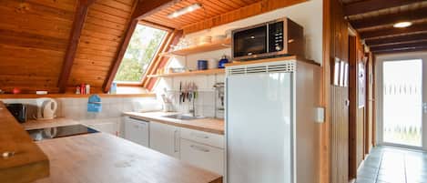 Fridge, stovetop, dishwasher, coffee/tea maker