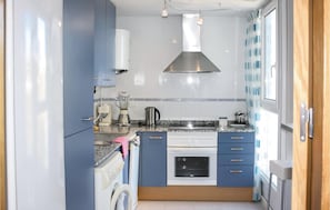 Fridge, stovetop, dishwasher, coffee/tea maker