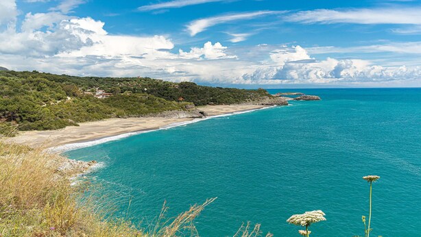 A coastal landscape with a beach, clear turquoise waters, and a hilly backdrop. - Amazing home in Acquavena di R. (SA) (Acquavena di R. (SA))