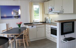Fridge, stovetop, dishwasher, coffee/tea maker