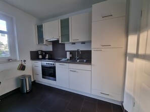 Fridge, oven, dishwasher, high chair