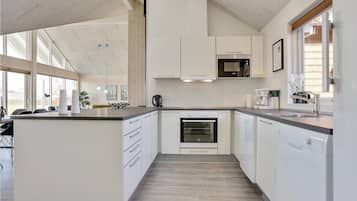 Fridge, stovetop, dishwasher, coffee/tea maker