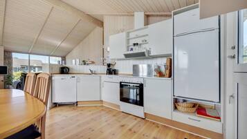 Fridge, stovetop, dishwasher, coffee/tea maker