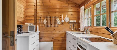 Fridge, stovetop, dishwasher, coffee/tea maker