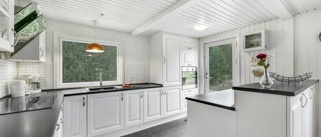 Fridge, stovetop, dishwasher, coffee/tea maker