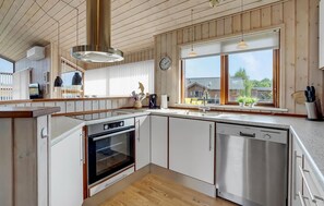 Fridge, stovetop, dishwasher, coffee/tea maker