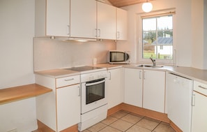 Fridge, stovetop, dishwasher, coffee/tea maker