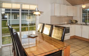 Fridge, stovetop, dishwasher, coffee/tea maker