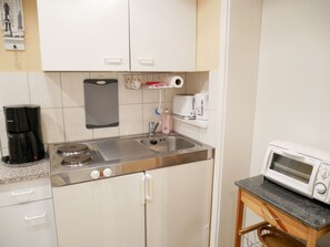 Fridge, coffee/tea maker, electric kettle, toaster