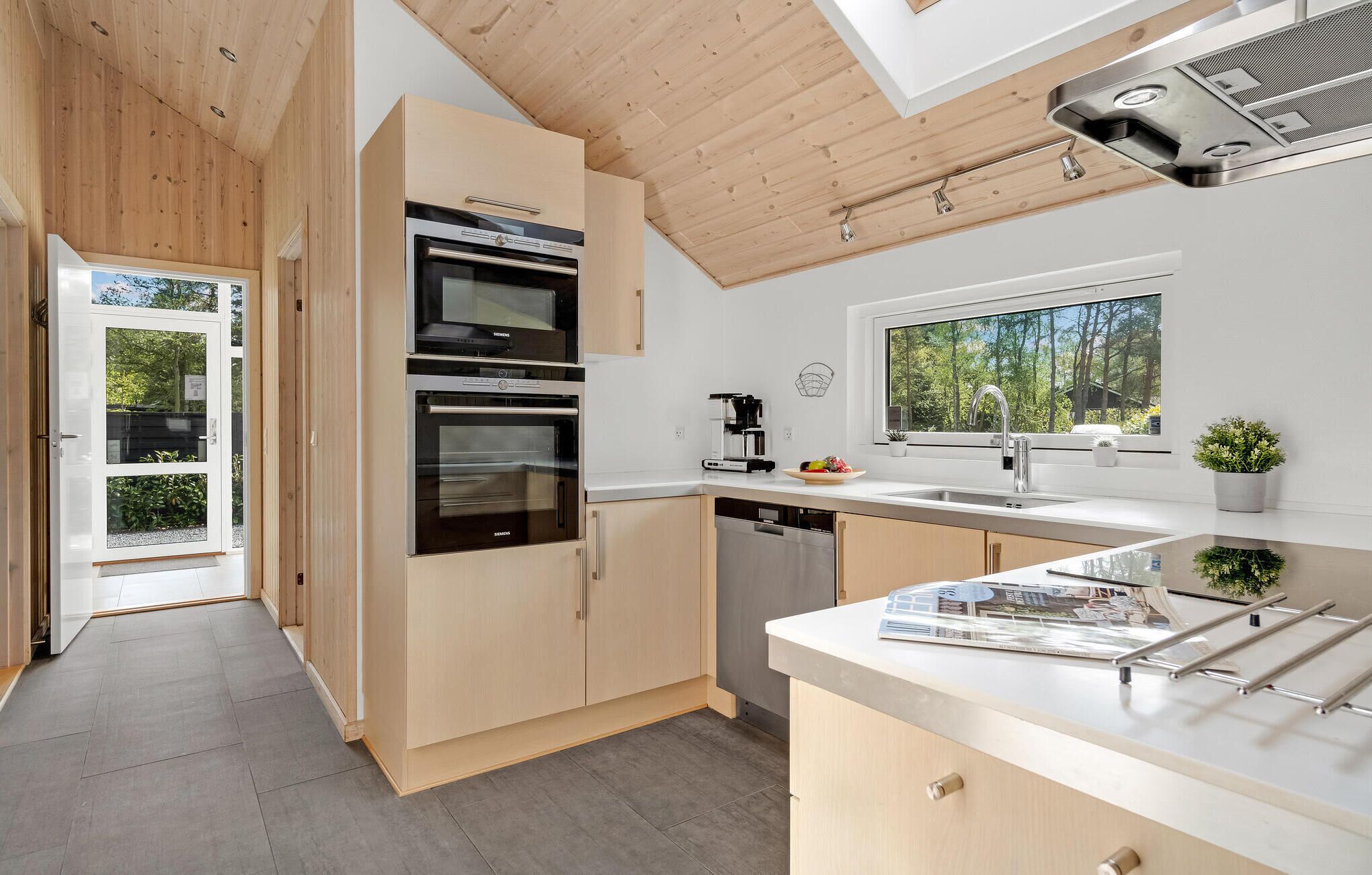 Fridge, stovetop, dishwasher, coffee/tea maker