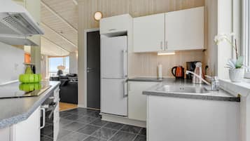Fridge, stovetop, dishwasher, coffee/tea maker
