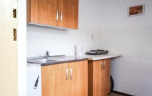 Fridge, stovetop, coffee/tea maker, cookware/dishes/utensils