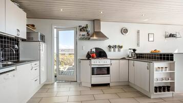 Fridge, stovetop, dishwasher, coffee/tea maker