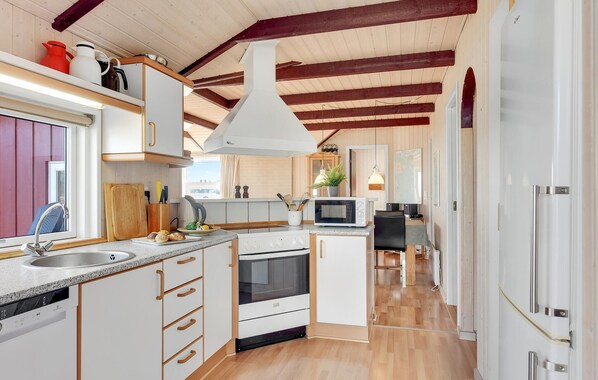 Fridge, stovetop, dishwasher, coffee/tea maker